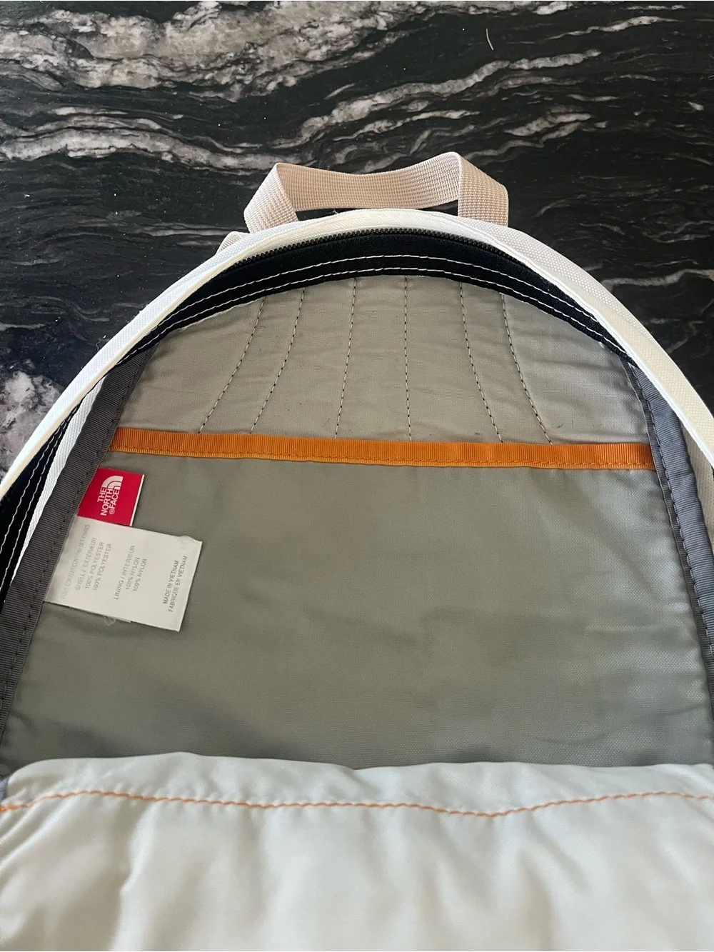 The North Face Cream and Gray Mini Backpack with Tan Accents